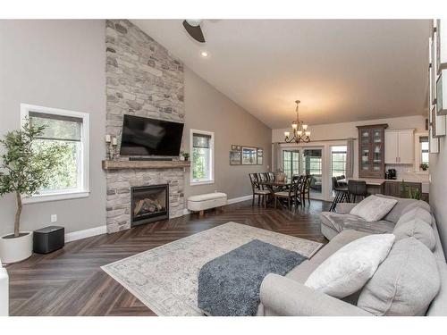 7024 Cobb Street, Lacombe, AB - Indoor Photo Showing Living Room With Fireplace