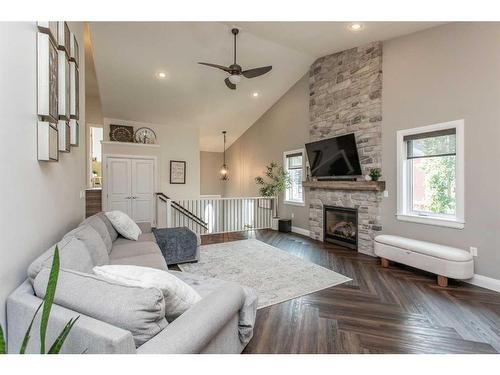 7024 Cobb Street, Lacombe, AB - Indoor Photo Showing Living Room With Fireplace