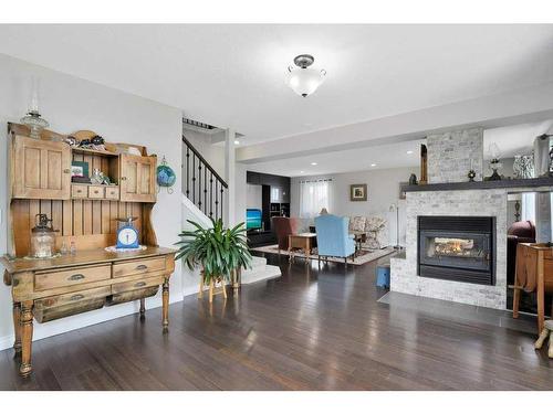 6006 44 Street Crescent, Innisfail, AB - Indoor Photo Showing Living Room With Fireplace