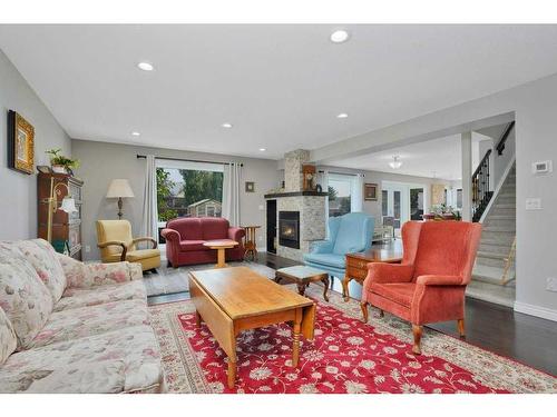 6006 44 Street Crescent, Innisfail, AB - Indoor Photo Showing Living Room With Fireplace