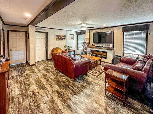 1417 Township Road 412, Rural Lacombe County, AB - Indoor Photo Showing Living Room With Fireplace