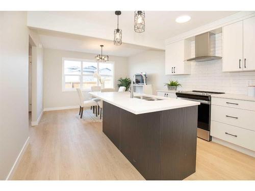 242 Halifax Close, Penhold, AB - Indoor Photo Showing Kitchen With Double Sink With Upgraded Kitchen