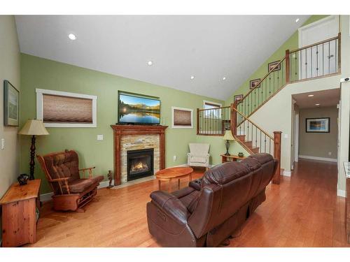 6071-25054 South Pine Lake Road, Rural Red Deer County, AB - Indoor Photo Showing Living Room With Fireplace