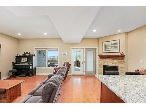 6071-25054 South Pine Lake Road, Rural Red Deer County, AB - Indoor Photo Showing Living Room With Fireplace