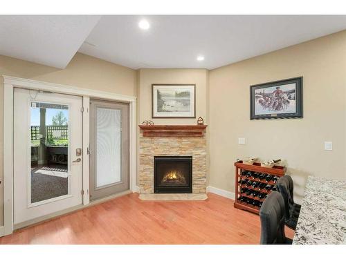 6071-25054 South Pine Lake Road, Rural Red Deer County, AB - Indoor Photo Showing Living Room With Fireplace