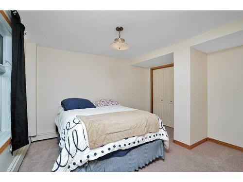 201, 35276 Range Road 10, Rural Red Deer County, AB - Indoor Photo Showing Bedroom