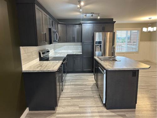 38 Latoria Court, Rural Red Deer County, AB - Indoor Photo Showing Kitchen With Stainless Steel Kitchen With Double Sink With Upgraded Kitchen