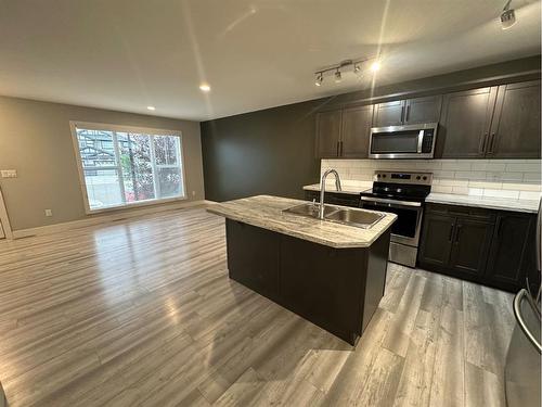 38 Latoria Court, Rural Red Deer County, AB - Indoor Photo Showing Kitchen With Double Sink