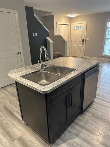 38 Latoria Court, Rural Red Deer County, AB - Indoor Photo Showing Kitchen With Double Sink