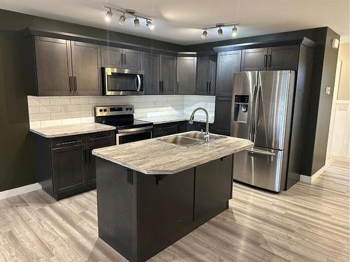 38 Latoria Court, Rural Red Deer County, AB - Indoor Photo Showing Kitchen With Stainless Steel Kitchen With Double Sink With Upgraded Kitchen