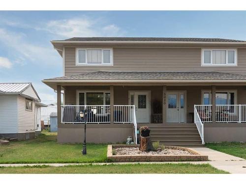 5020A 49 Street, Killam, AB - Outdoor With Deck Patio Veranda With Facade