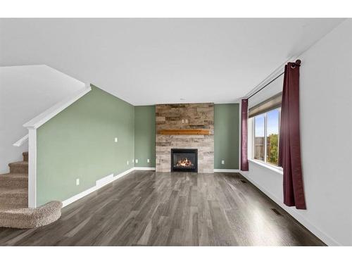 157 Bowman Circle, Sylvan Lake, AB - Indoor Photo Showing Living Room With Fireplace