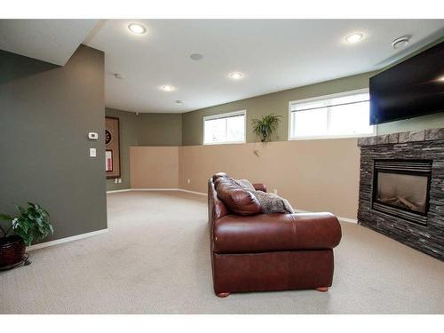 14 Lewis Close, Red Deer, AB - Indoor Photo Showing Other Room With Fireplace