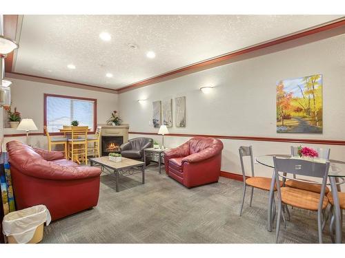 131-18 Averill Street, Red Deer, AB - Indoor Photo Showing Living Room With Fireplace