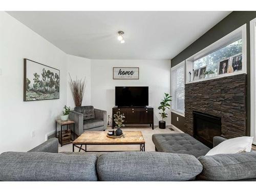 61 Arnold Close, Red Deer, AB - Indoor Photo Showing Living Room With Fireplace