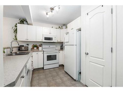 61 Arnold Close, Red Deer, AB - Indoor Photo Showing Kitchen With Double Sink