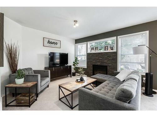 61 Arnold Close, Red Deer, AB - Indoor Photo Showing Living Room With Fireplace