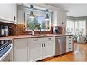 15 Duston Street, Red Deer, AB  - Indoor Photo Showing Kitchen With Double Sink 