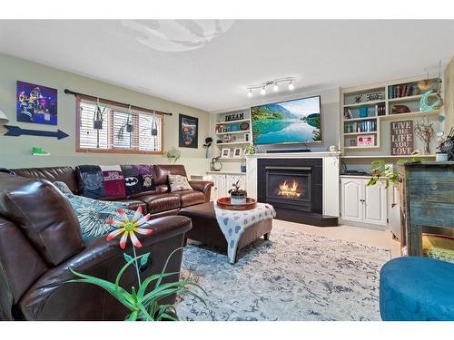 15 Duston Street, Red Deer, AB - Indoor Photo Showing Living Room With Fireplace