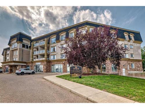 411-4425 Heritage Way, Lacombe, AB - Outdoor With Balcony With Facade