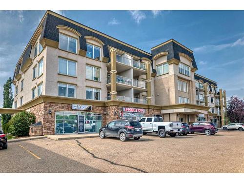 411-4425 Heritage Way, Lacombe, AB - Outdoor With Balcony With Facade