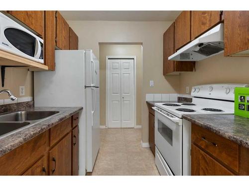 404-5418 52 Street, Camrose, AB - Indoor Photo Showing Kitchen With Double Sink