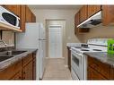 404-5418 52 Street, Camrose, AB  - Indoor Photo Showing Kitchen With Double Sink 