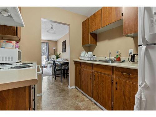 202-5418 52 Street, Camrose, AB - Indoor Photo Showing Kitchen With Double Sink