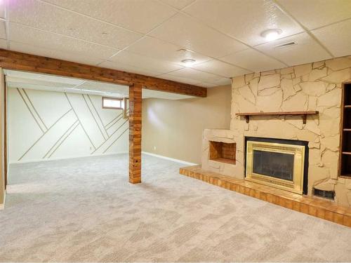 83 Barrett Drive, Red Deer, AB - Indoor With Fireplace