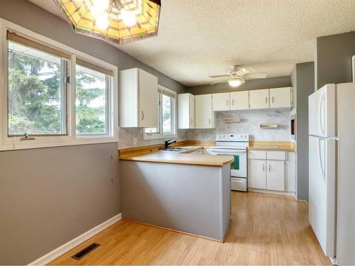 83 Barrett Drive, Red Deer, AB - Indoor Photo Showing Kitchen With Double Sink