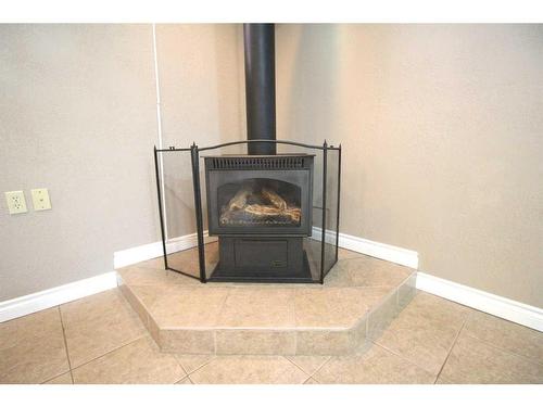 4624 49 Street, Red Deer, AB - Indoor With Fireplace