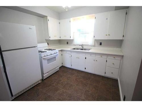 4624 49 Street, Red Deer, AB - Indoor Photo Showing Kitchen With Double Sink