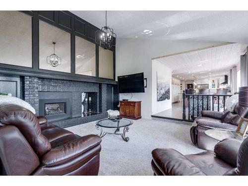 Twp Rd 384, Rural Red Deer County, AB - Indoor Photo Showing Living Room With Fireplace