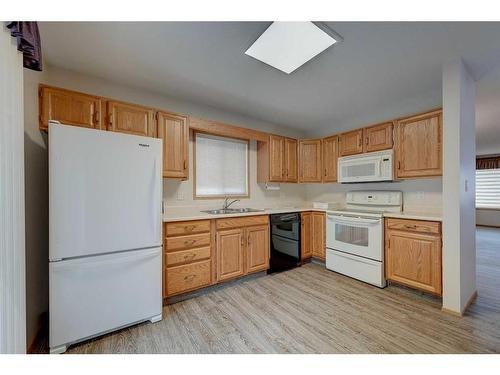 25-2821 Botterill Crescent, Red Deer, AB - Indoor Photo Showing Kitchen With Double Sink