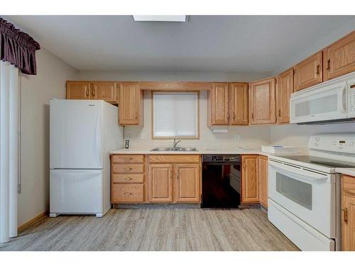 25-2821 Botterill Crescent, Red Deer, AB - Indoor Photo Showing Kitchen With Double Sink