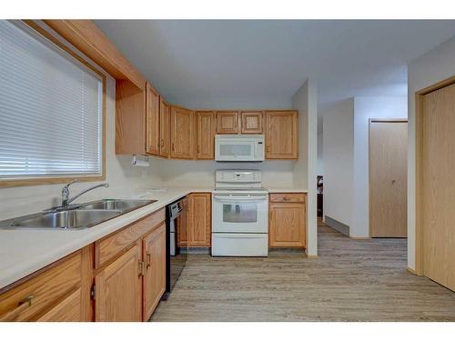 25-2821 Botterill Crescent, Red Deer, AB - Indoor Photo Showing Kitchen With Double Sink