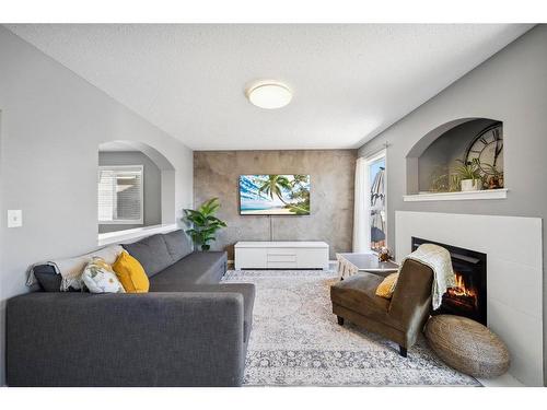 140 Vickers Close, Red Deer, AB - Indoor Photo Showing Living Room With Fireplace