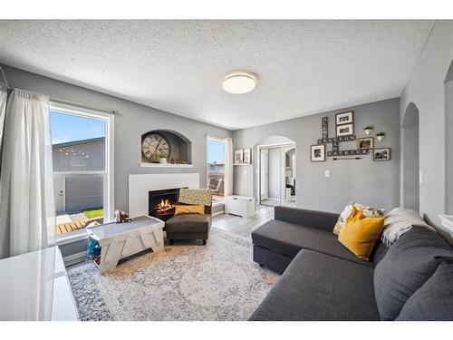 140 Vickers Close, Red Deer, AB - Indoor Photo Showing Living Room With Fireplace