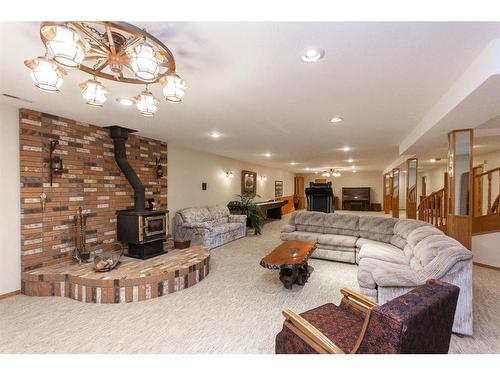 37440 Range Road 264, Rural Red Deer County, AB - Indoor Photo Showing Living Room With Fireplace