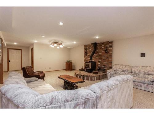 37440 Range Road 264, Rural Red Deer County, AB - Indoor Photo Showing Living Room With Fireplace