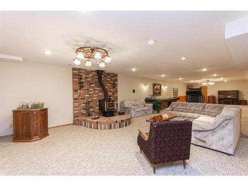 37440 Range Road 264, Rural Red Deer County, AB - Indoor Photo Showing Living Room With Fireplace