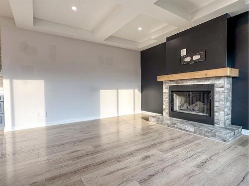 5 Bishop Circle, Carstairs, AB - Indoor Photo Showing Living Room With Fireplace