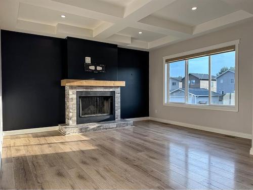 5 Bishop Circle, Carstairs, AB - Indoor Photo Showing Living Room With Fireplace