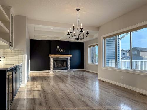 5 Bishop Circle, Carstairs, AB - Indoor With Fireplace