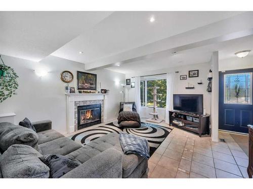 23 Edis Close, Red Deer, AB - Indoor Photo Showing Living Room With Fireplace