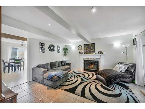 23 Edis Close, Red Deer, AB - Indoor Photo Showing Living Room With Fireplace