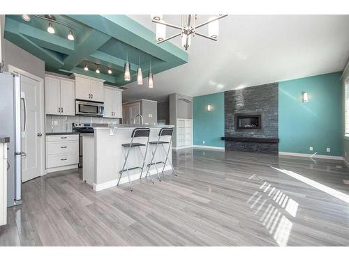 360 Kingston Drive, Red Deer, AB - Indoor Photo Showing Kitchen With Fireplace With Upgraded Kitchen