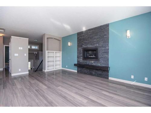 360 Kingston Drive, Red Deer, AB - Indoor Photo Showing Living Room With Fireplace