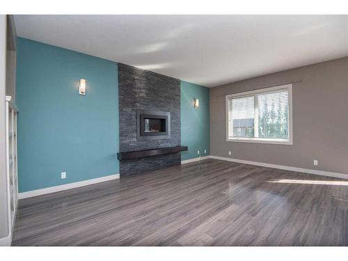 360 Kingston Drive, Red Deer, AB - Indoor Photo Showing Living Room With Fireplace