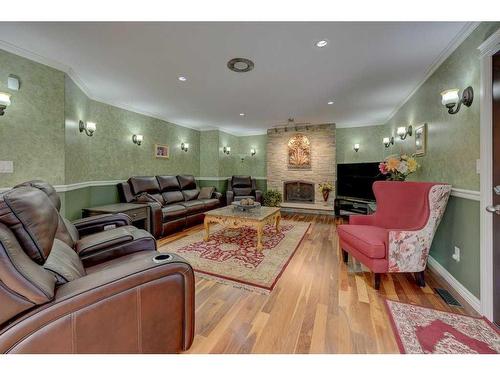 39070 Range Road 281, Rural Red Deer County, AB - Indoor Photo Showing Living Room With Fireplace